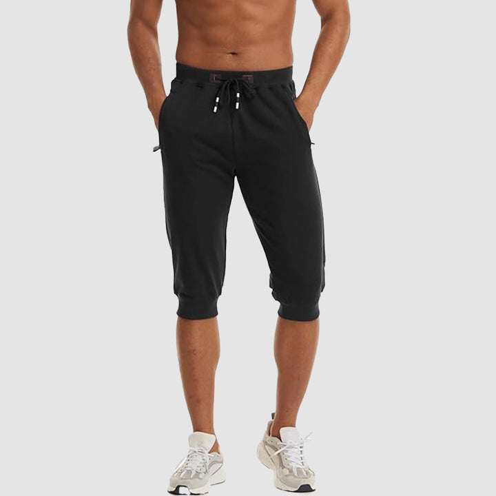 【Buy 4 Get 4th Free】Men's 3/4 Jogger Capri Pants with Zipper Pockets Knee Length Running Training Workout Shorts - MAGCOMSEN