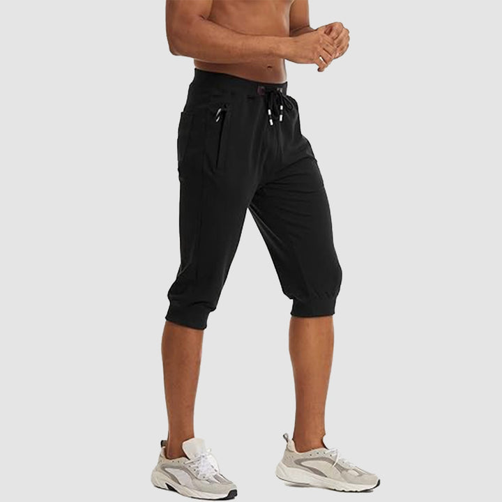 【Buy 4 Get 4th Free】Men's 3/4 Jogger Capri Pants with Zipper Pockets Knee Length Running Training Workout Shorts - MAGCOMSEN